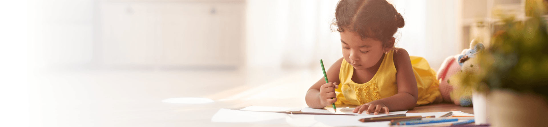 Child writing at a desk